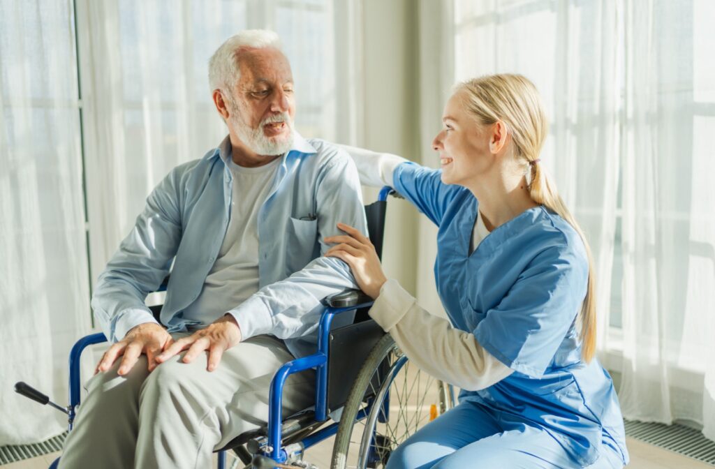 A skilled nurse visits an older adult at home for home healthcare.