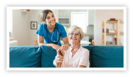 Graceworks at Home aide posing with client on couch