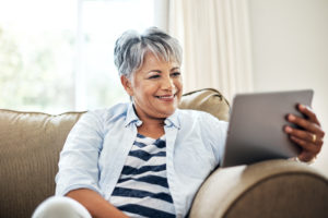 Senior woman using a tablet at home
