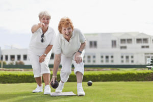 Older women playing lawn bowling