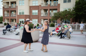 Senior living residents at Bethany Village dancing at the annual outdoor concert.