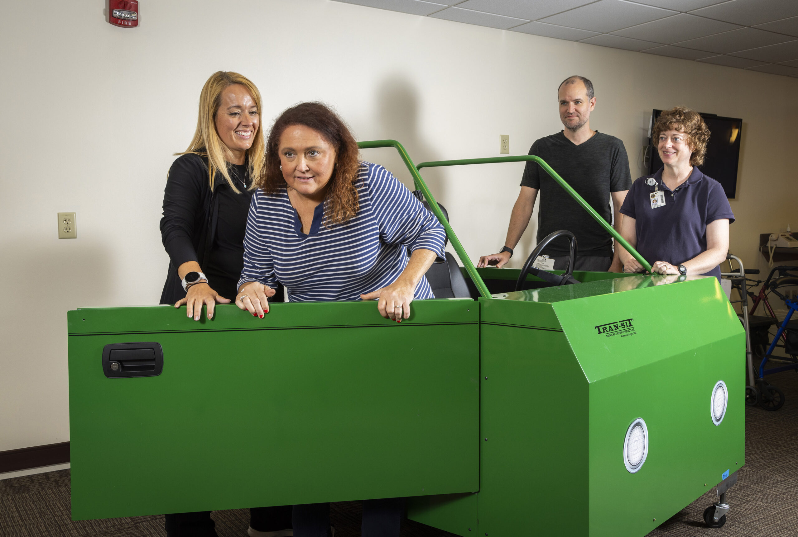 Bethany Rehabilitation staff demonstrate using a car simulator as part of a senior's recovery program