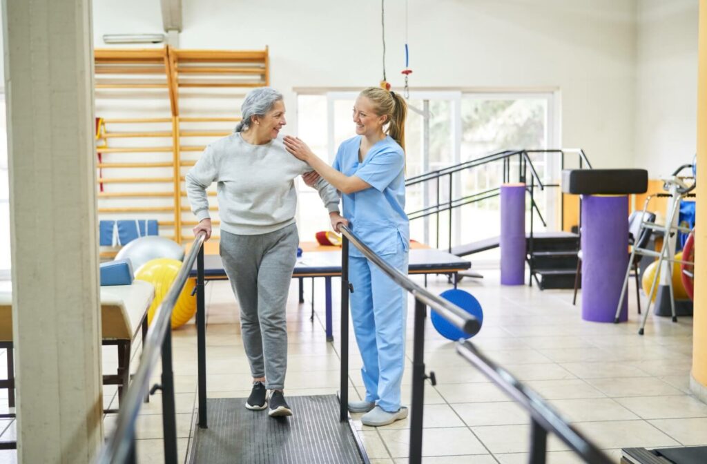 A physical therapist helps a senior with their rehabilitation goals.